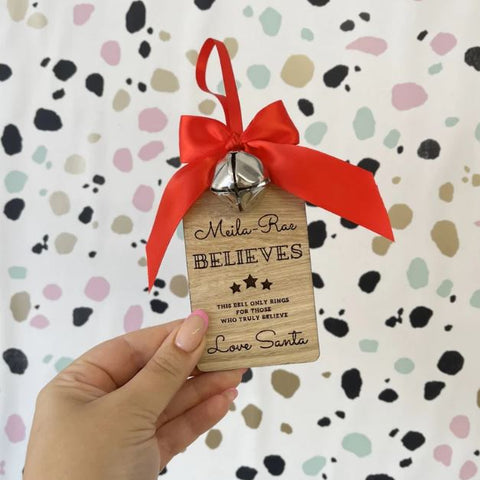 Personalised Santa's believe jingle bell on wooden tag