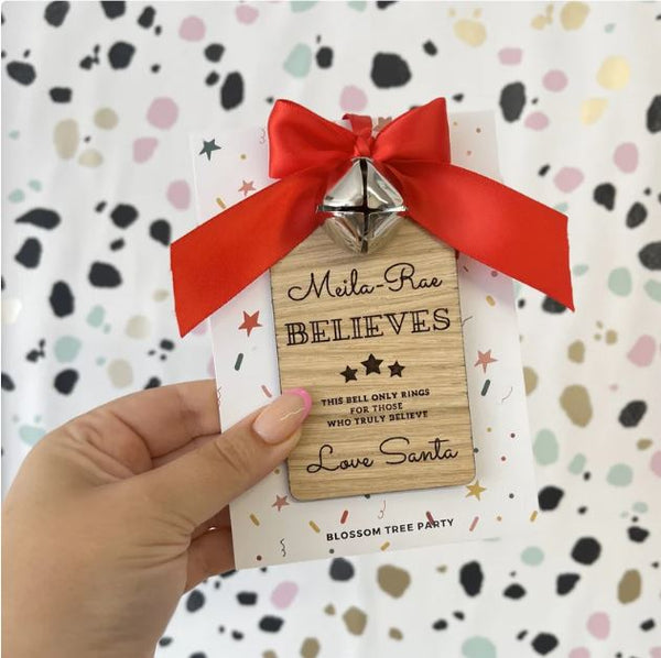 Personalised Santa's believe jingle bell on wooden tag